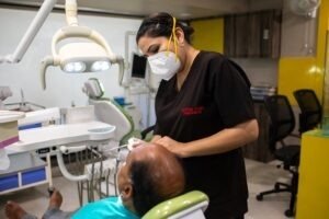 Dentist Performing Dental Checkup at Medident Clinic Indore