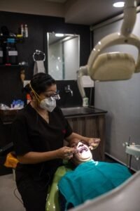 Dentist Performing Procedure on a Patient at Medident Clinic Indore