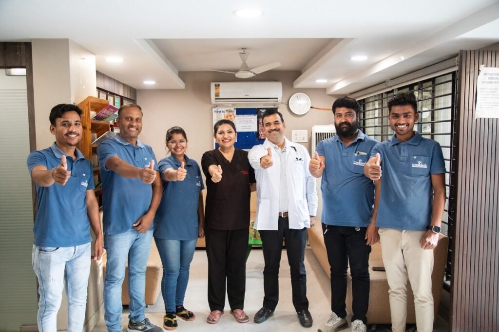 Medident Clinic Indore Team Giving Thumbs Up