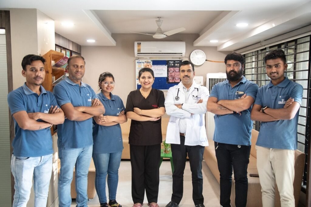 Medident Clinic Indore Team Posing with Crossed Arms
