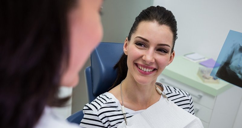 Patient Smiling During Dental Consultation at Medident Clinic Indore